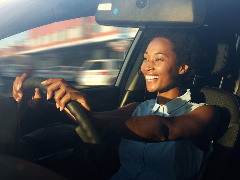 happy girl driving car